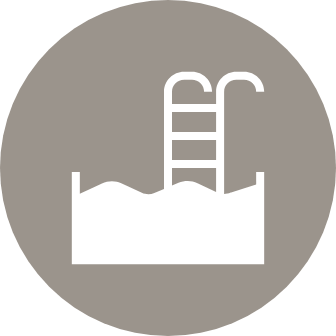 Resort-style pool with surrounding courtyard
